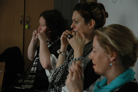Photographs of teachers trying the rubber band test : photo - Kamina Walton.