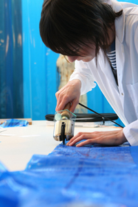 Making one of the dresses, photo - Alex Maguire.